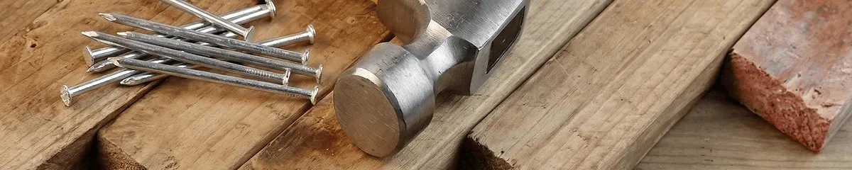 Hammer and nails on hardwood flooring boards in Chicago, IL