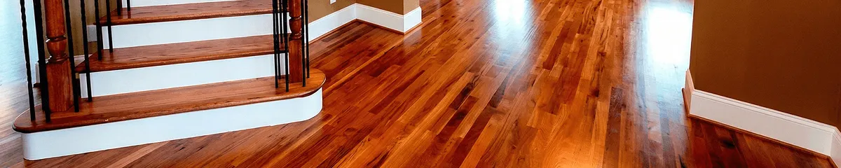 Base floor of a staircase with professionally restored wood flooring in Chicago IL