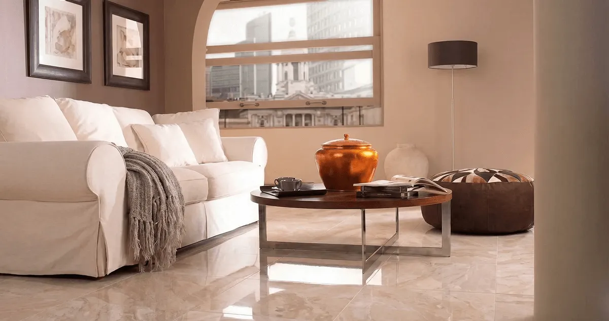 Modern living room with professionally installed marble flooring, a beige sofa, coffee table in Chicago, IL